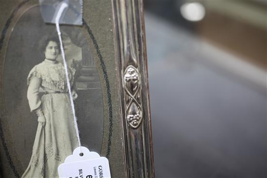 An Edwardian Art Nouveau repousse silver photograph frame, 11.25in.